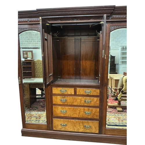 108 - A late Victorian carved mahogany mirrored wardrobe, width 208cm, depth 60cm, height 218cm
