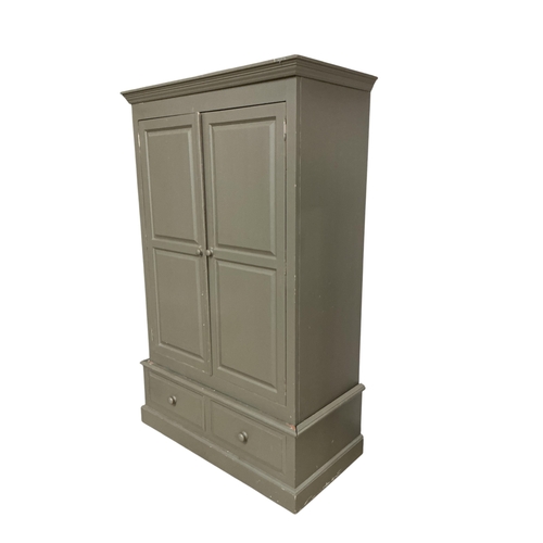 113 - A painted pine larder cupboard, width 124cm, depth 92cm, height 200cm