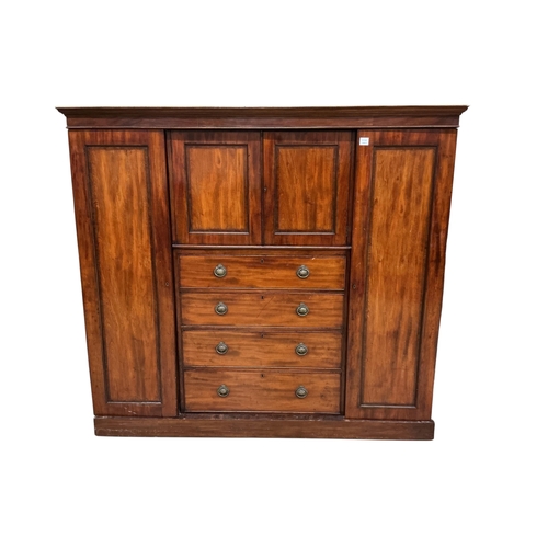 96 - A Victorian mahogany compactum wardrobe, width 188cm, depth 52cm, height 170cm