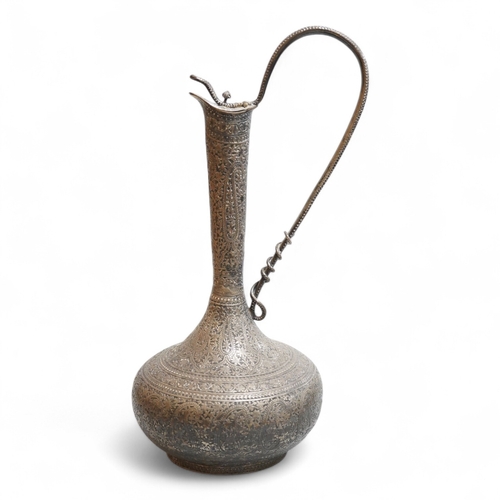 A late 19th century Indian white metal ewer, with extensive foliate ...