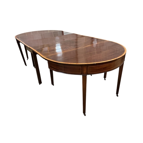 1027 - A George III satinwood banded mahogany D end extending dining table, with two spare leaves, 284cm ex... 