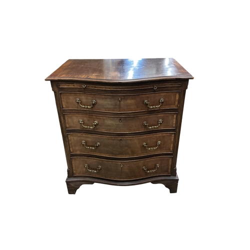 1035 - A pair of reproduction George III style serpentine mahogany four drawer chests with brushing slides,... 