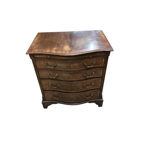 1035 - A pair of reproduction George III style serpentine mahogany four drawer chests with brushing slides,... 