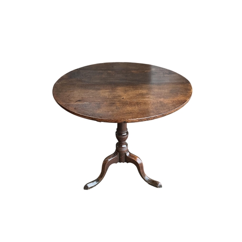 2002 - An early 19th century circular oak tilt top tripod tea table, diameter 76cm, height 72cm