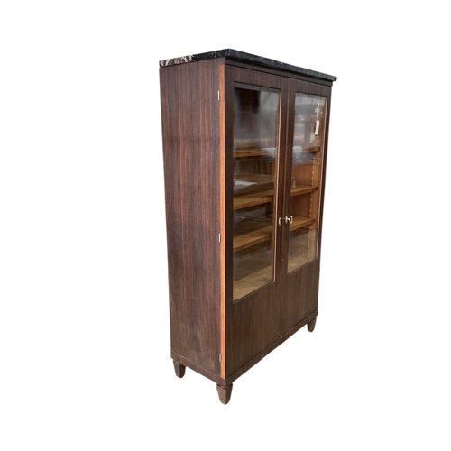 2015 - A French Art Deco marble topped coromandel bookcase, width 92cm, depth 38cm, height 151cm