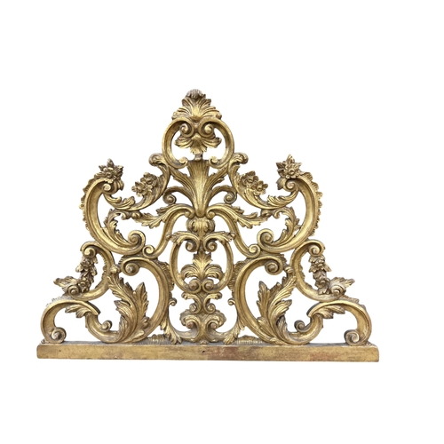 2022 - An early 20th century carved giltwood pediment, width 108cm, height 82cm