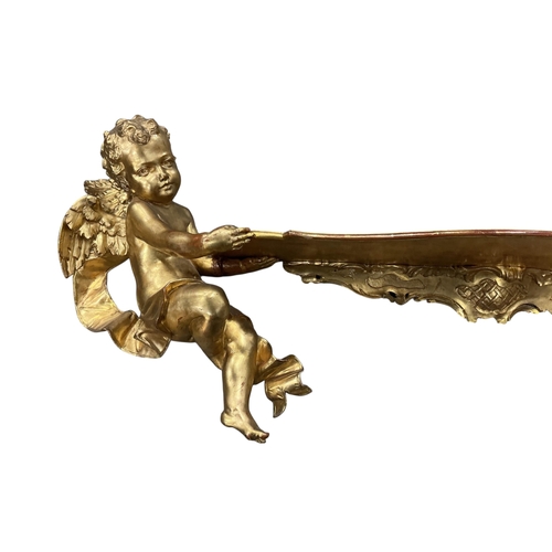 2026 - A Victorian style giltwood and composition cherub wall bracket, width 102cm, height 38cm