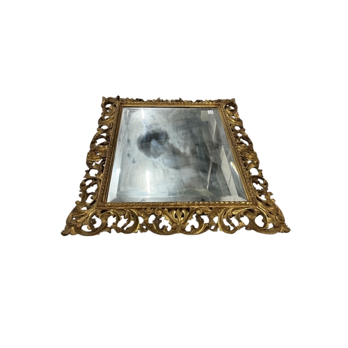 2027 - A large 19th century Florentine style carved giltwood rectangular wall mirror, width 112cm, height 8... 