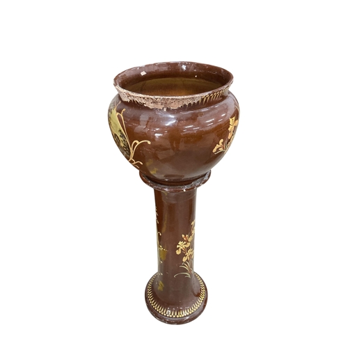 2033 - A Victorian glazed earthenware jardiniere on stand, diameter 44cm, height 108cm