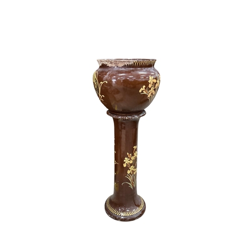 2033 - A Victorian glazed earthenware jardiniere on stand, diameter 44cm, height 108cm
