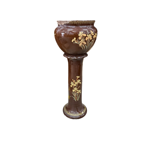 2033 - A Victorian glazed earthenware jardiniere on stand, diameter 44cm, height 108cm