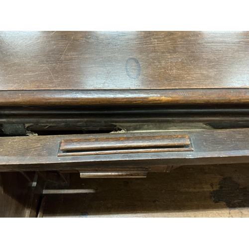 2035 - An early 20th century oak 'S' shaped tambour roll top desk, width 124cm, depth 78cm, height 120cm... 