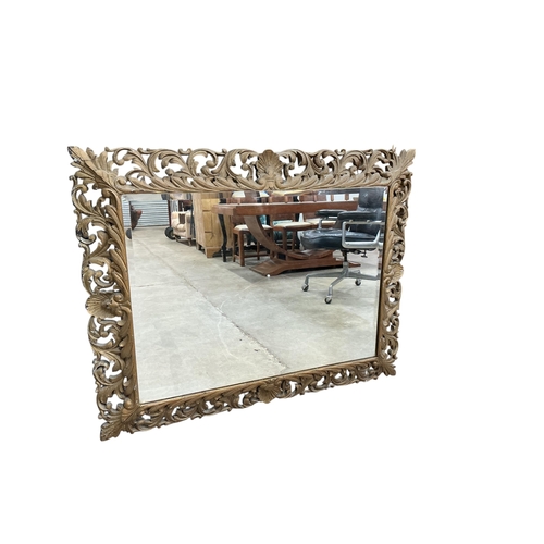 2036 - A large late 19th / early 20th century rectangular carved giltwood wall mirror, width 97cm, height 1... 