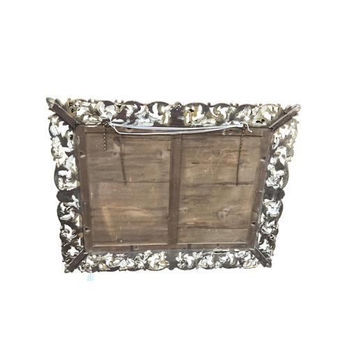2036 - A large late 19th / early 20th century rectangular carved giltwood wall mirror, width 97cm, height 1... 