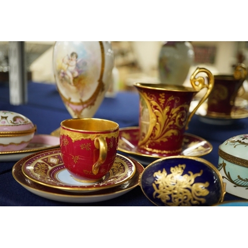 2468 - A collection of porcelain to include a Vienna cabinet cup and saucer,  continental ormolu mounted ur... 