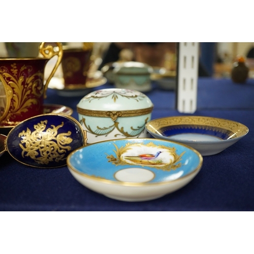 2468 - A collection of porcelain to include a Vienna cabinet cup and saucer,  continental ormolu mounted ur... 