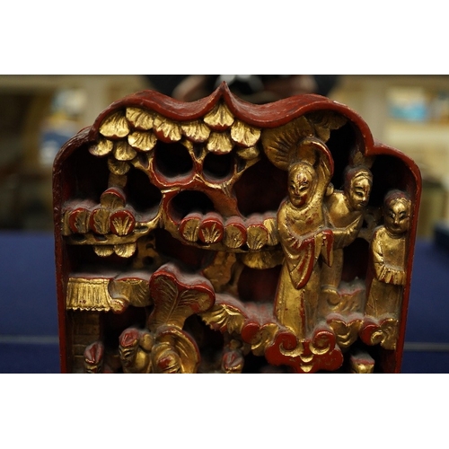 2479 - A Chinese carved and giltwood panel, sancai figure and carved coquilla nut, largest 21 x 14.5cm... 