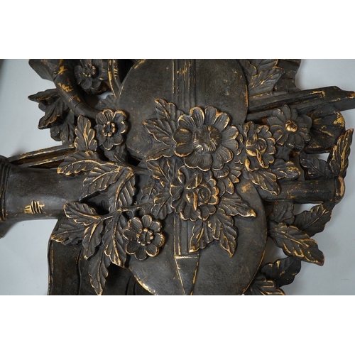 2494 - A folk art partially gilt carved panel, 50cm high