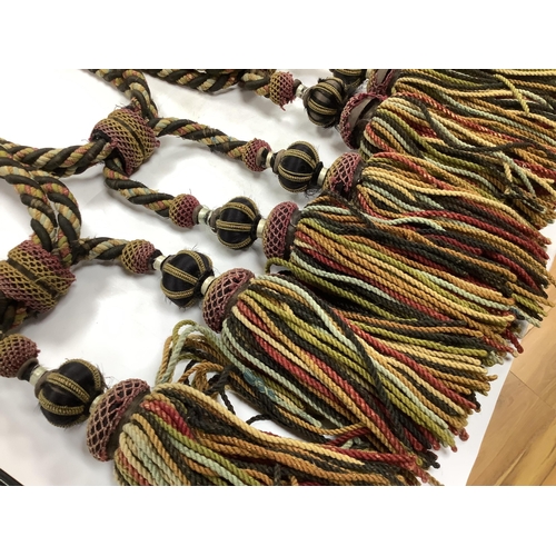 2497 - Four pairs of late 19th early 20th century corded and tasseled black and multicoloured tie backs. 69... 