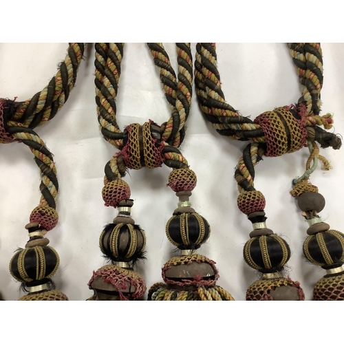 2497 - Four pairs of late 19th early 20th century corded and tasseled black and multicoloured tie backs. 69... 