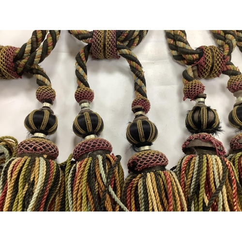2497 - Four pairs of late 19th early 20th century corded and tasseled black and multicoloured tie backs. 69... 