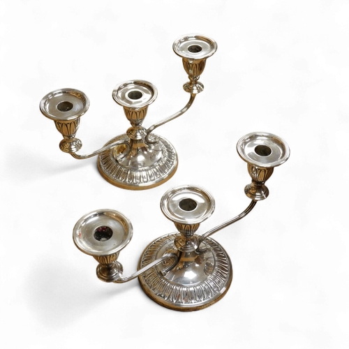 A pair of Elizabeth II silver mounted two branch, three light dwarf ...