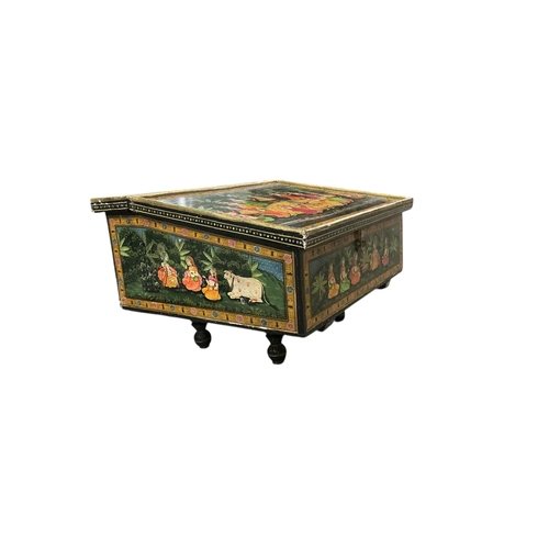 1062 - An Indian Kashmir desk with hinged slant top, width 58cm, depth 56cm, height 38cm