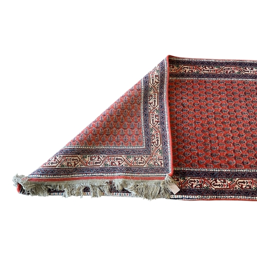 1067 - A Saraband red ground runner, 248 x 82cm