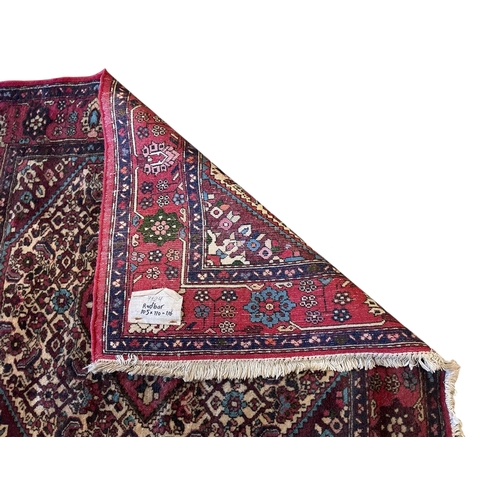 1068 - A North West Persian rug, 107 x 103cm