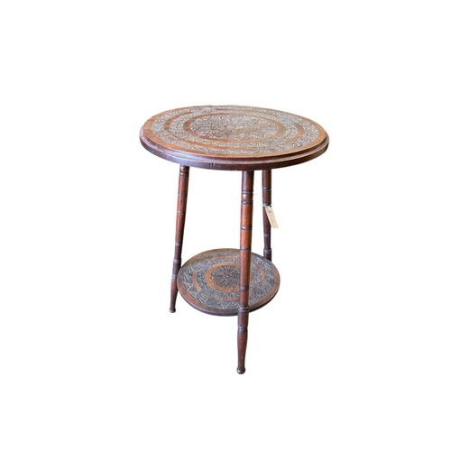 1071 - A late 19th century Anglo Indian chip carved two tier occasional table, diameter 44cm, height 67cm... 