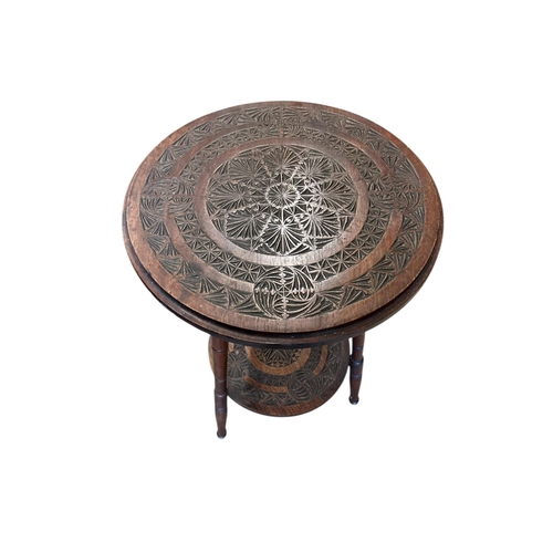 1071 - A late 19th century Anglo Indian chip carved two tier occasional table, diameter 44cm, height 67cm... 