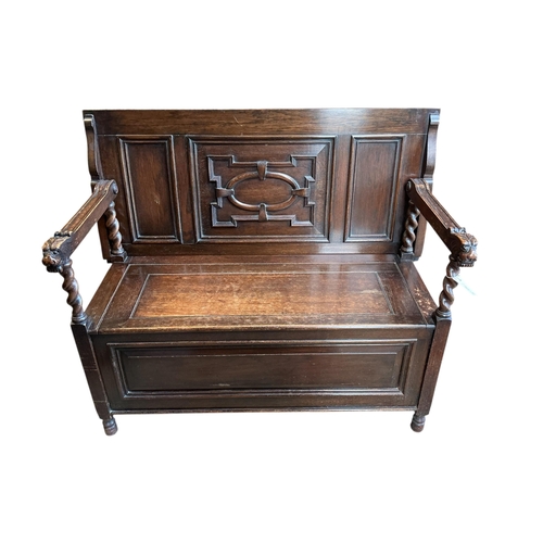 1075 - An early 20th century carved oak monk's bench, width 114cm, depth 54cm, height 93cm