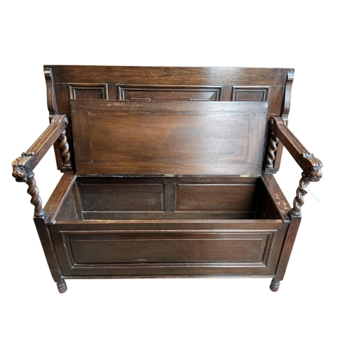 1075 - An early 20th century carved oak monk's bench, width 114cm, depth 54cm, height 93cm