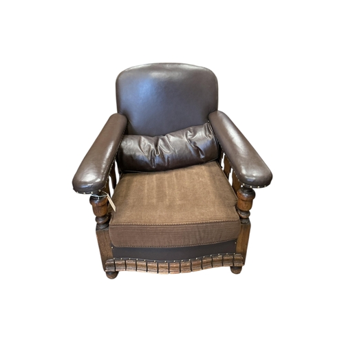 1082 - A near pair of early 20th century brown leather and fabric upholstery oak club armchairs, larger wid... 