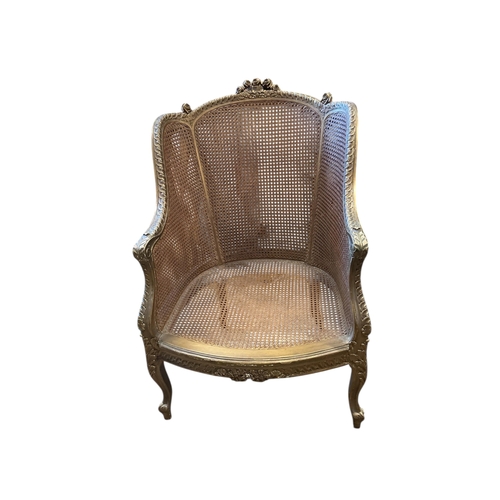 1087 - A Louis XVI style giltwood and canework bergere armchair, width 66cm, depth 62cm, height 102cm... 
