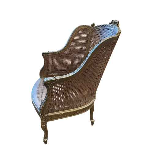 1087 - A Louis XVI style giltwood and canework bergere armchair, width 66cm, depth 62cm, height 102cm... 