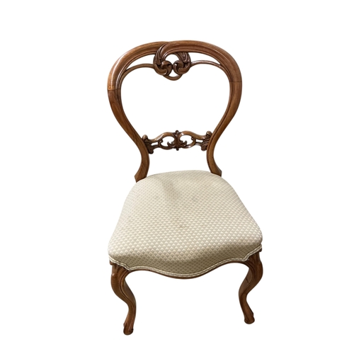 1091 - A set of six Victorian walnut balloon back dining chairs