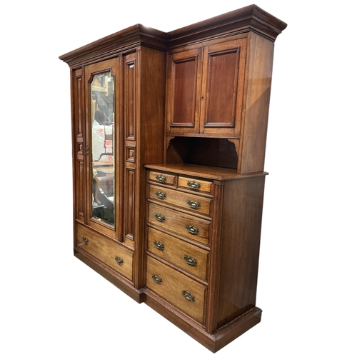 1093 - A late Victorian walnut mirrored compactum wardrobe, width 212cm, depth 56cm, height 211cm