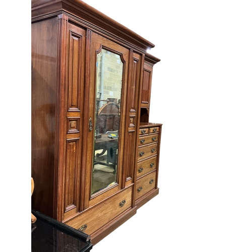 1093 - A late Victorian walnut mirrored compactum wardrobe, width 212cm, depth 56cm, height 211cm