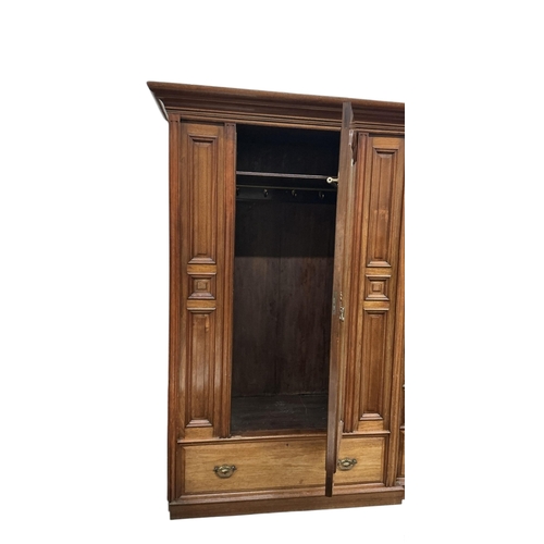 1093 - A late Victorian walnut mirrored compactum wardrobe, width 212cm, depth 56cm, height 211cm
