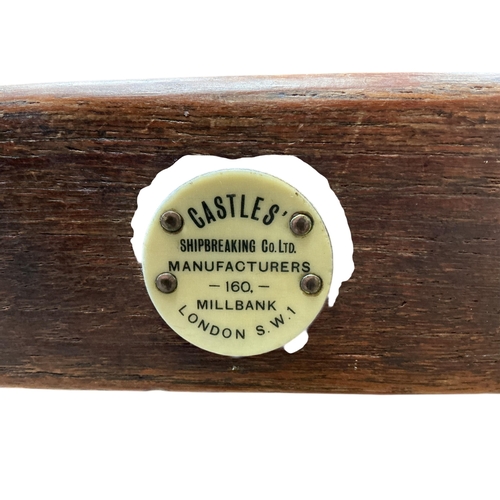 1097 - An early 20th century oak two tier trolley by Castles, London, width 55cm, depth 39cm, height 84cm... 