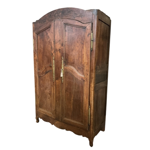 1107 - An early 19th century French brass mounted fruitwood armoire, width 132cm, depth 60cm, height 219cm... 