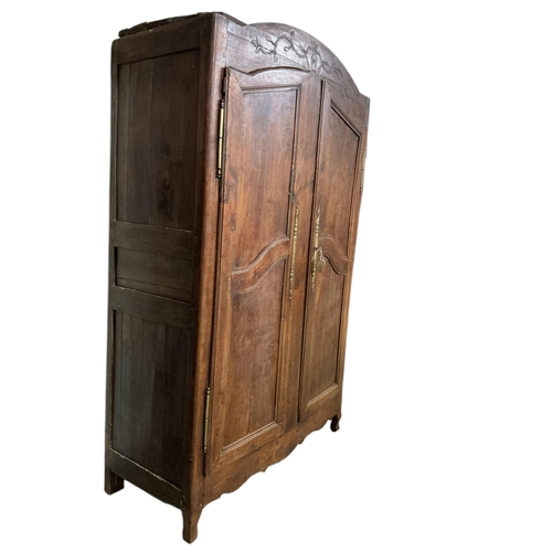 1107 - An early 19th century French brass mounted fruitwood armoire, width 132cm, depth 60cm, height 219cm... 