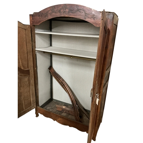 1107 - An early 19th century French brass mounted fruitwood armoire, width 132cm, depth 60cm, height 219cm... 