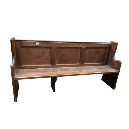 1108 - A Victorian panelled oak pew, width 196cm, depth 50cm, height 97cm