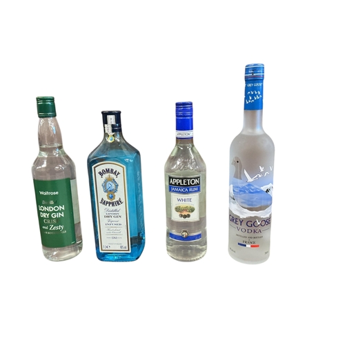 1110 - Eight bottles of assorted spirits and liqueur to include Greygoose Vodka, Graham's Blend No.5 White ... 