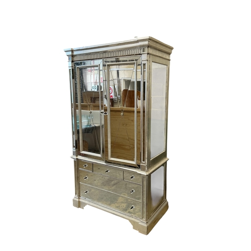 1114 - A Contemporary mirrored media cabinet, width 144cm, depth 67cm, height 22cm