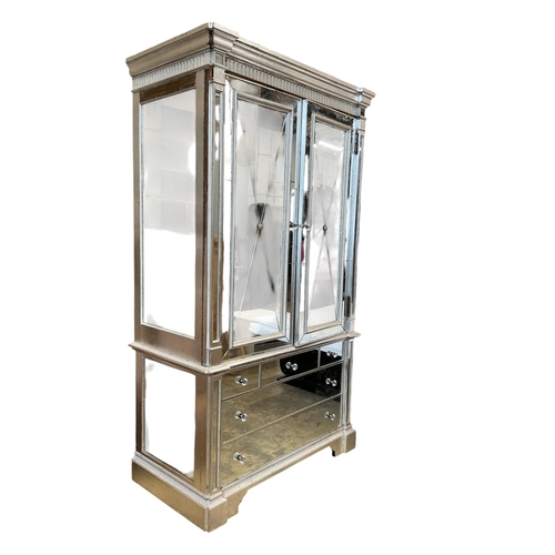 1114 - A Contemporary mirrored media cabinet, width 144cm, depth 67cm, height 22cm