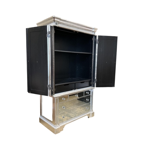 1114 - A Contemporary mirrored media cabinet, width 144cm, depth 67cm, height 22cm