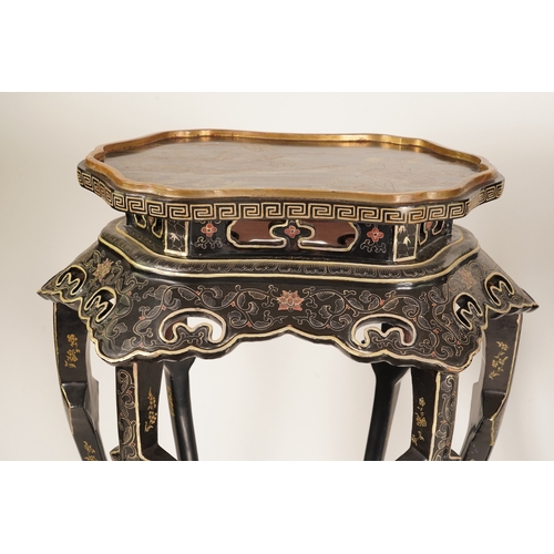 1131 - Two similar Chinese gilt-decorated black lacquer jardiniere stands, 20th century, each shaped top de... 
